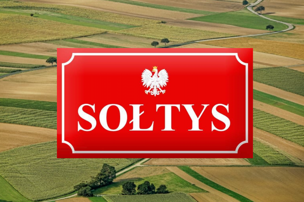 pole, tabliczka z napisem ”sołtys”